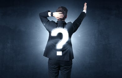 Businessman standing and thinking about questions-1