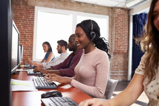 happy employee using sage crm with seamless integration