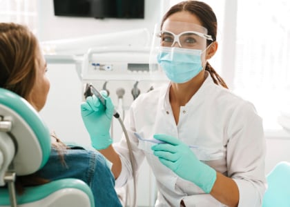 dentist in office working on a patient