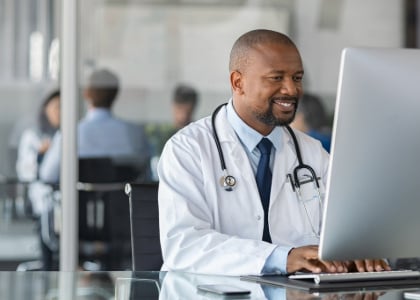 medical doctor working on sage intacct accounting system