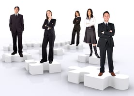 business teamwork on puzzle pieces over a white background
