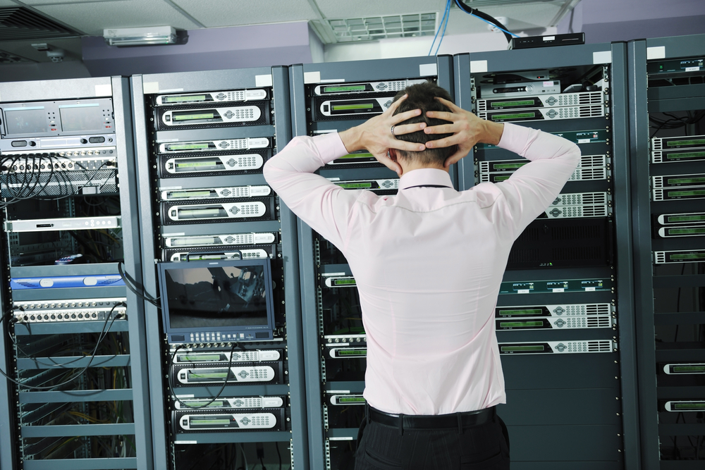 it business man in network server room have problems and looking for disaster situation solution-2