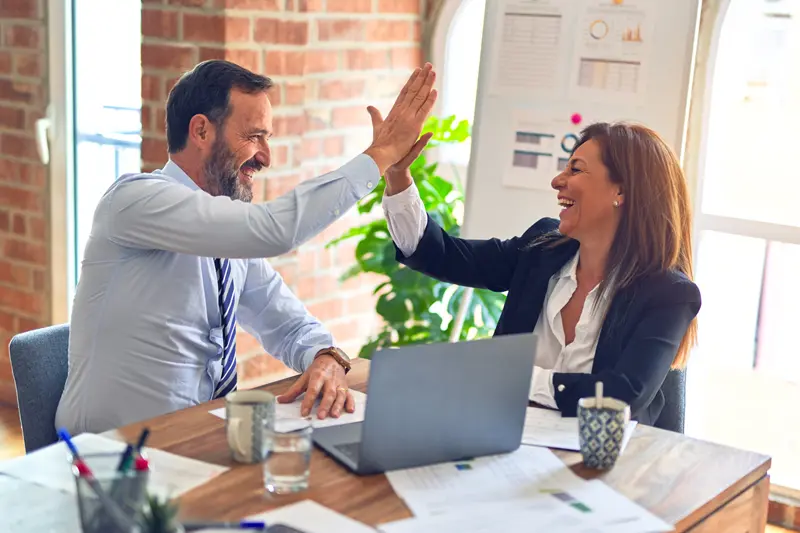 Success high five man and woman