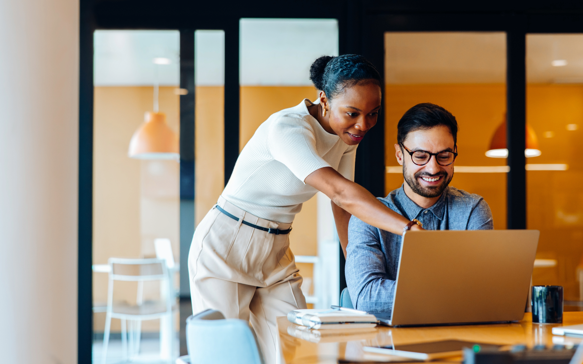 Man and woman looking at a computer screen
