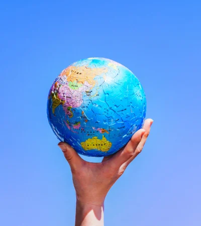 Hand holding globe
