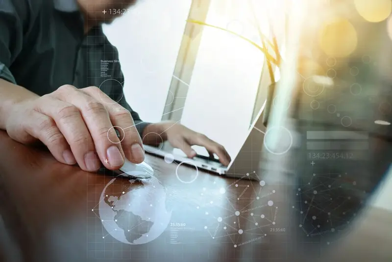 man on laptop clicking mouse