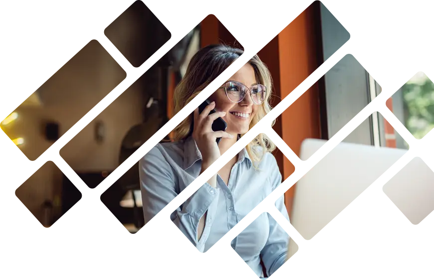 Woman on phone and computer looking out window