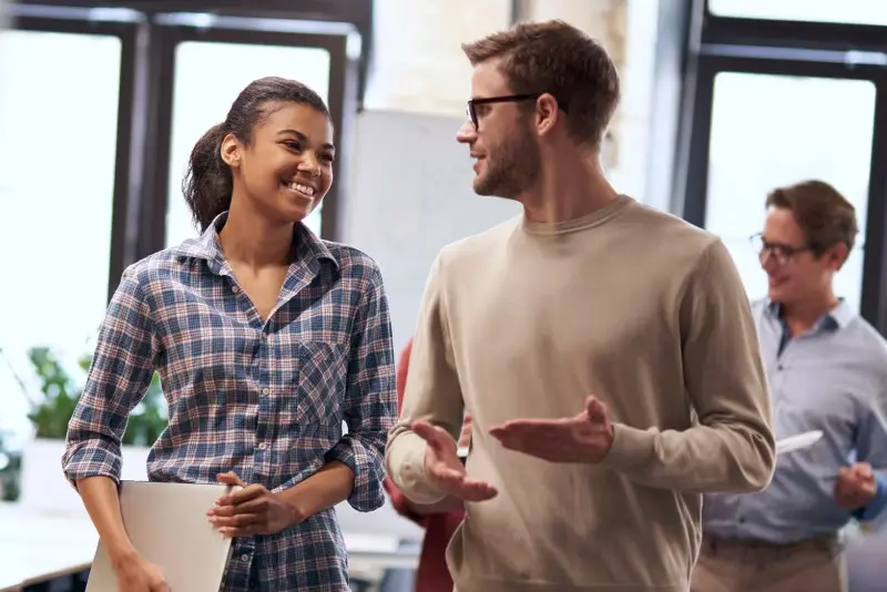 two coworkers talking